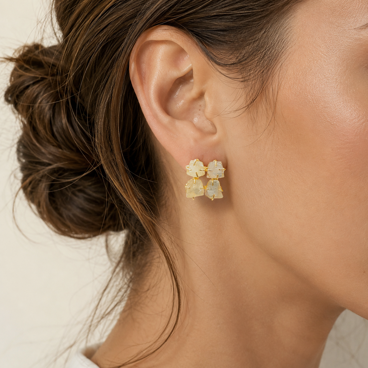 Rough citrine gold plated stud earrings shown from a front angle with textured stones.