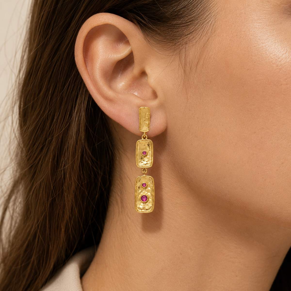 Triple rectangle gold-plated drop earrings with pink stone details.