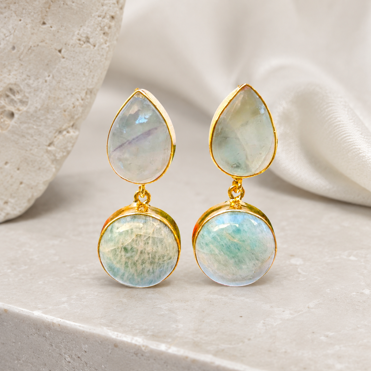 Pair of amazonite drop earrings with a teardrop top and round bottom stone.