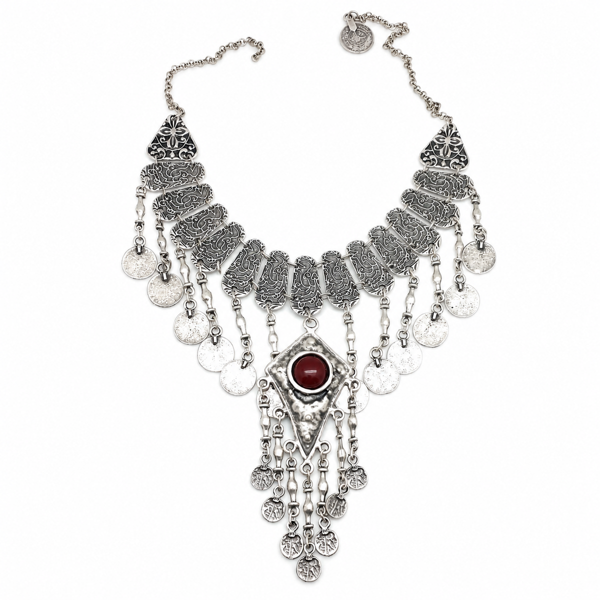 Silver-tone statement necklace with coin details and a tassel pendant.