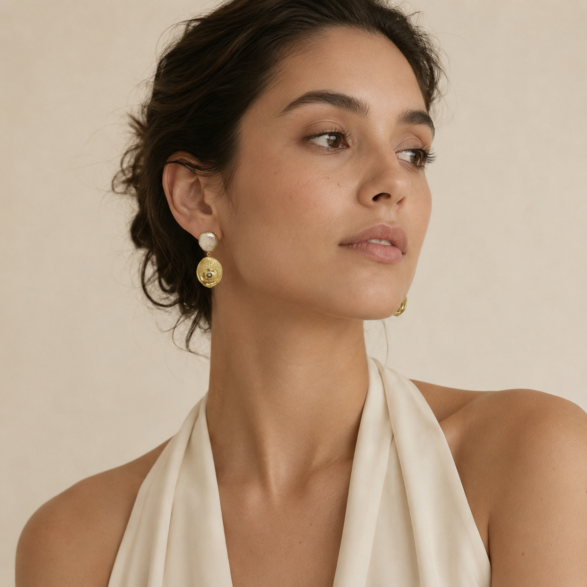 Pearl-like and gold-plated drop earrings with a textured finish.