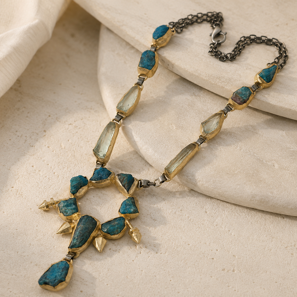 Angled view of the teal raw stone pendant necklace with a dark chain.