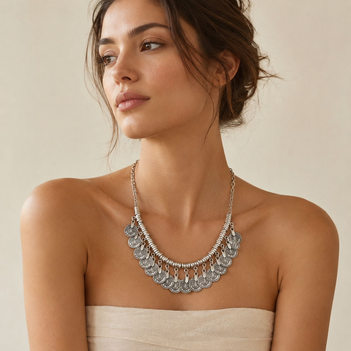 Silver-tone disc coin collar necklace with a bold fringe look.
