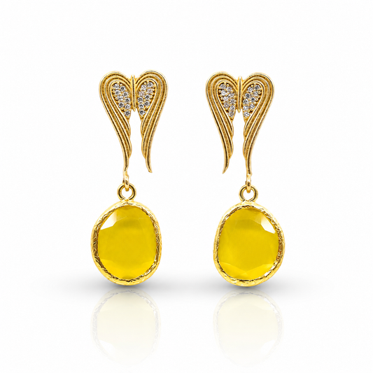 Gold-tone heart-shaped dangle earrings with black crystal detail.