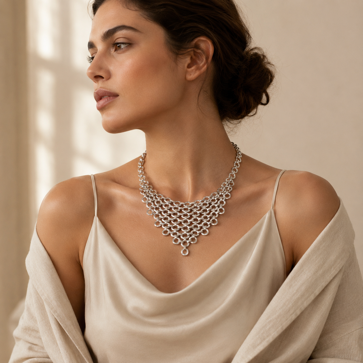Silver-tone mesh bib necklace with a layered front design.