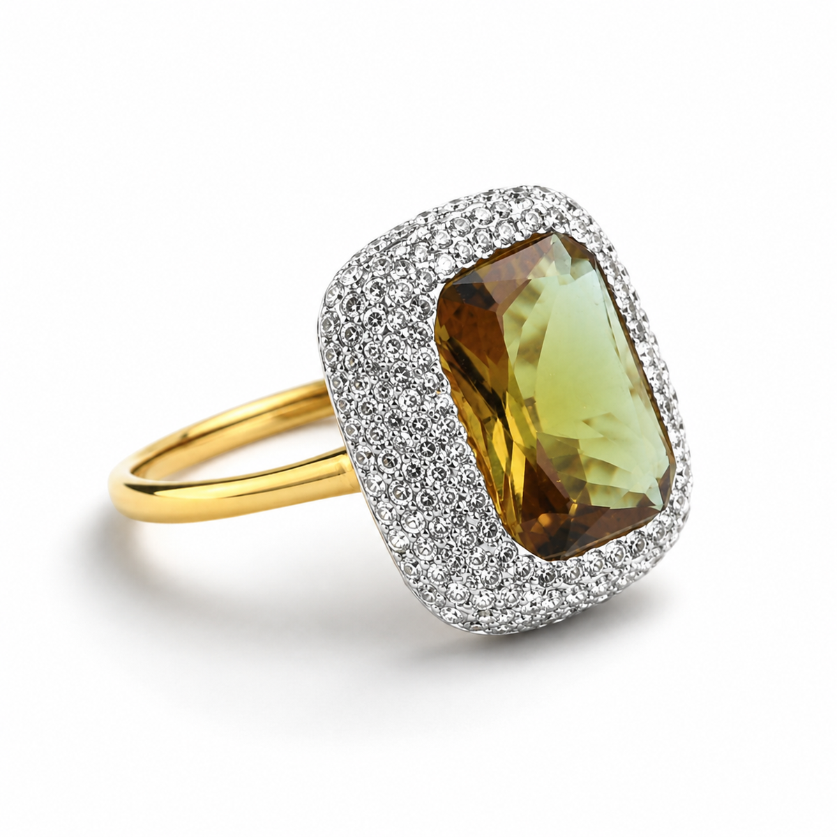 Angled view of a rectangular faceted stone ring with a sparkling halo and gold-tone band.