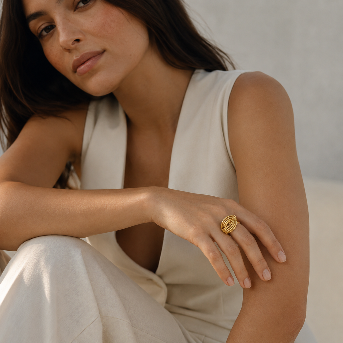 Gold-plated multi band ring with a bold knot-inspired design.