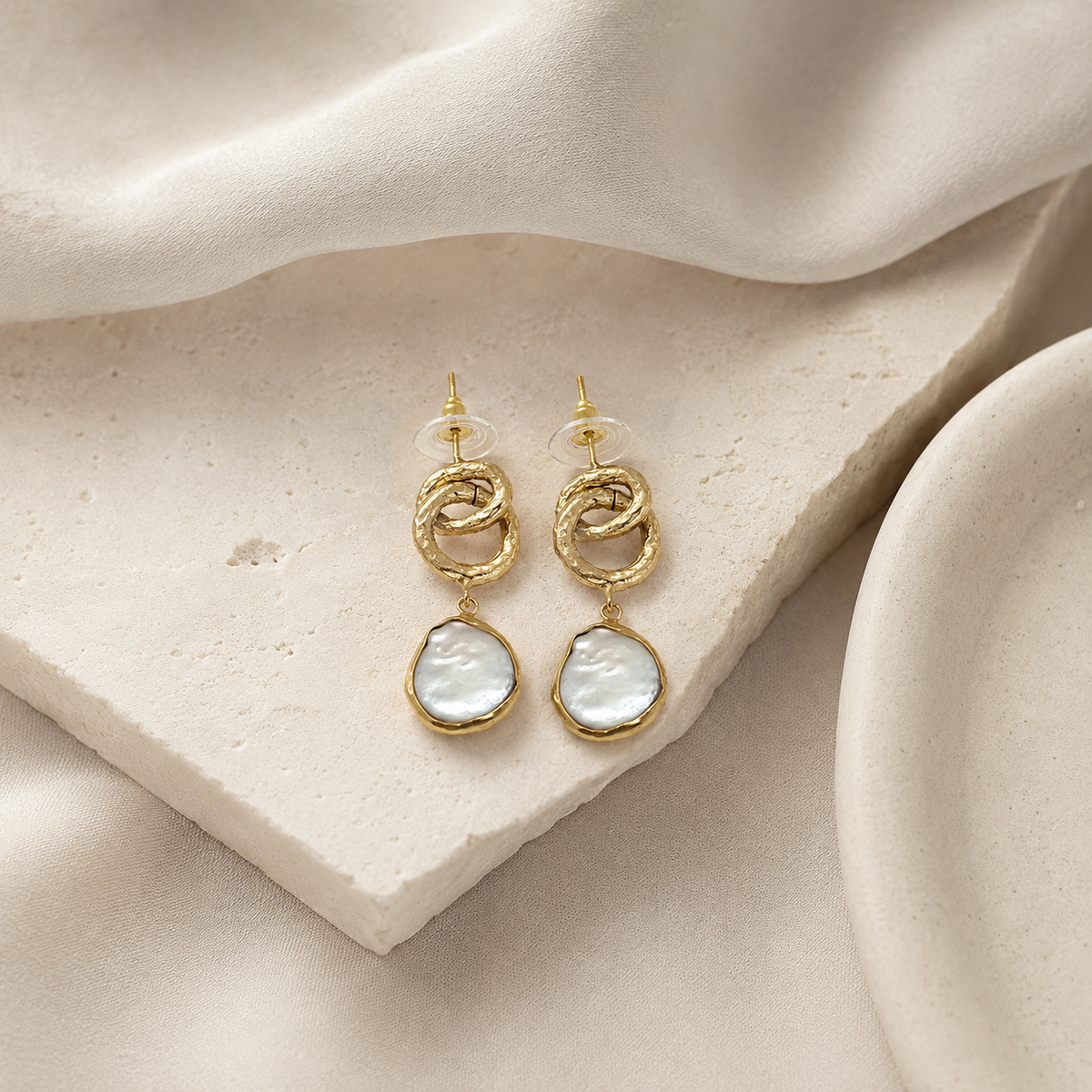 Gold plated drop earrings with a modern chain silhouette.