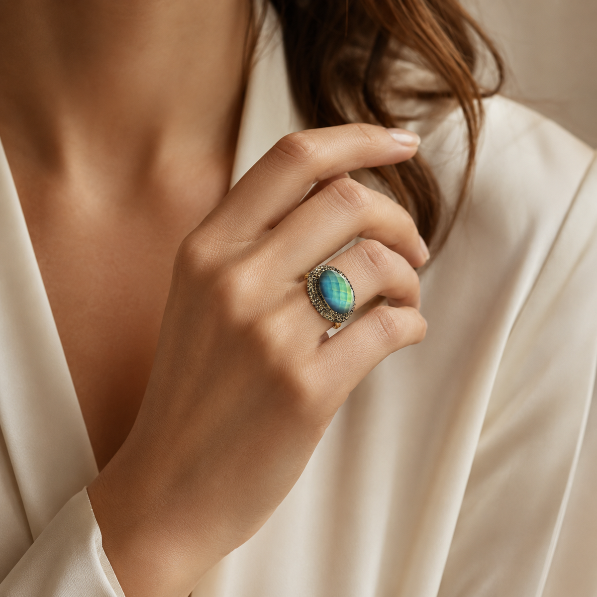 Round color-changing ring with a faceted center stone framed by a sparkling halo.