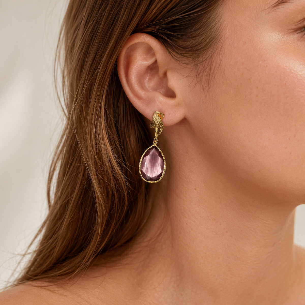 Purple tulip-inspired drop earrings with a gold-plated finish and faceted teardrop shape.