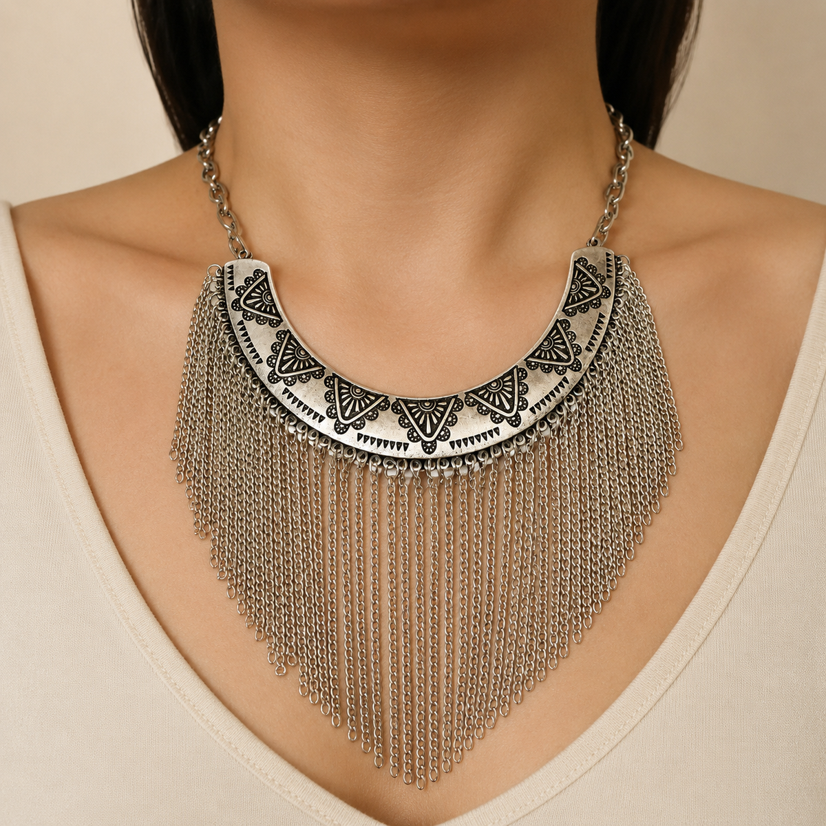 Silver-tone engraved collar necklace shown front view with flowing chain fringe.