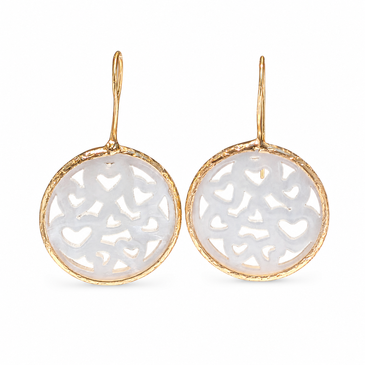 Gold-plated drop earrings with mother of pearl heart cutouts.