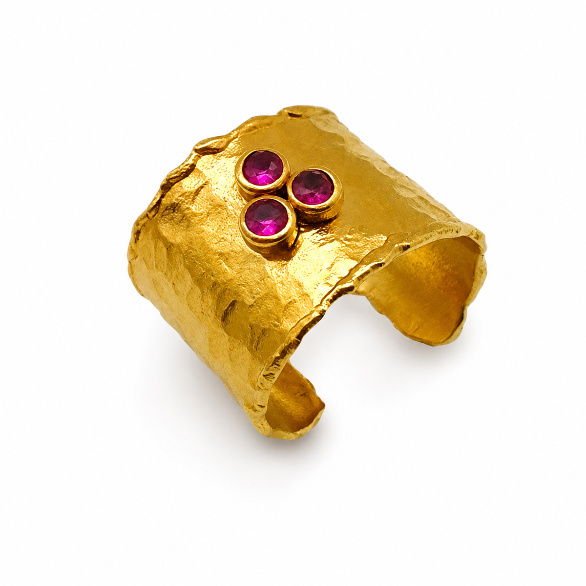 Hammered gold-plated cuff ring with three ruby pink stones.