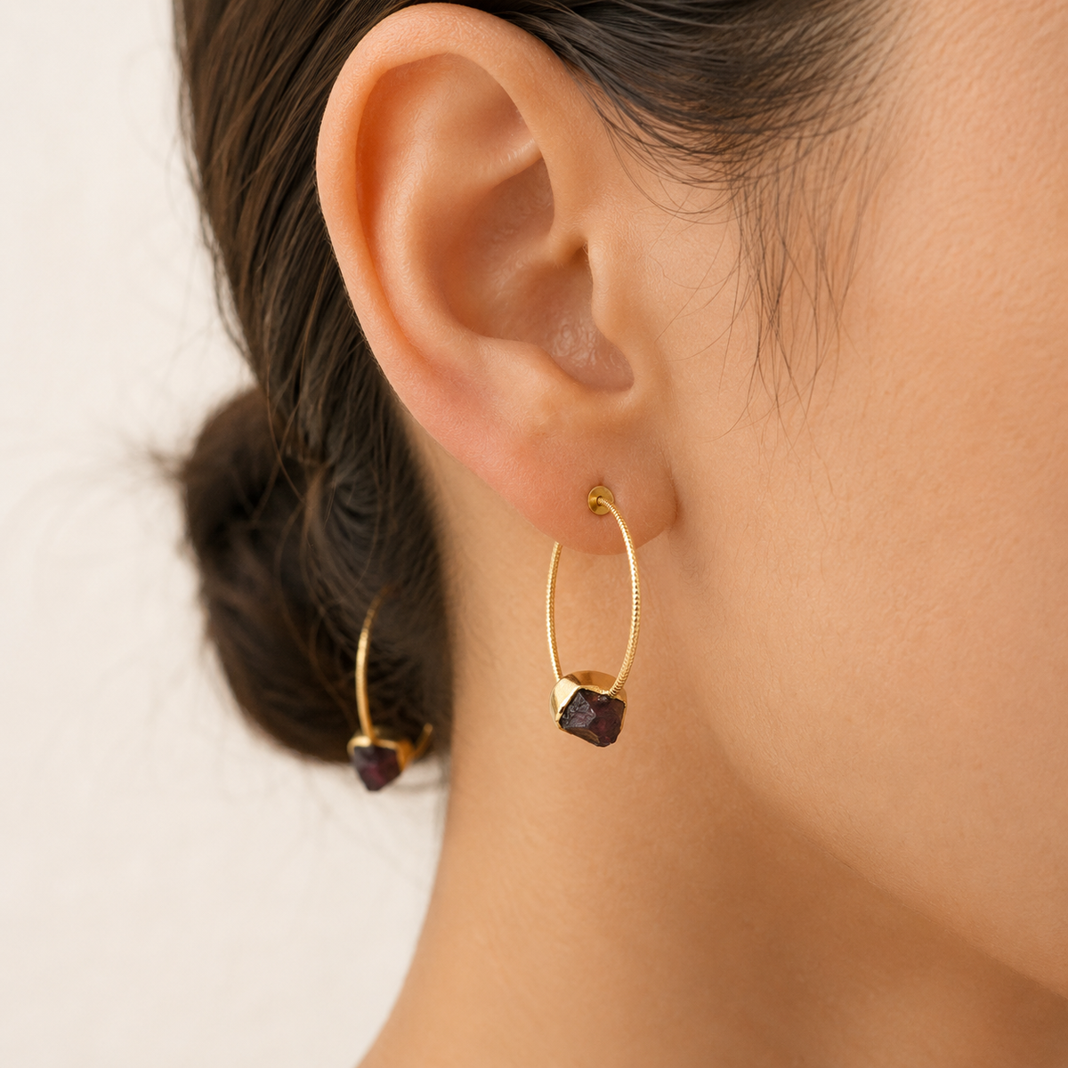 Gold-plated hook earrings with green agate slice stones shown from the front.