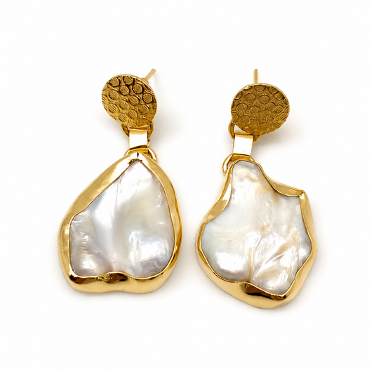 Gold drop earrings with mother of pearl in an organic shape and textured stud tops.