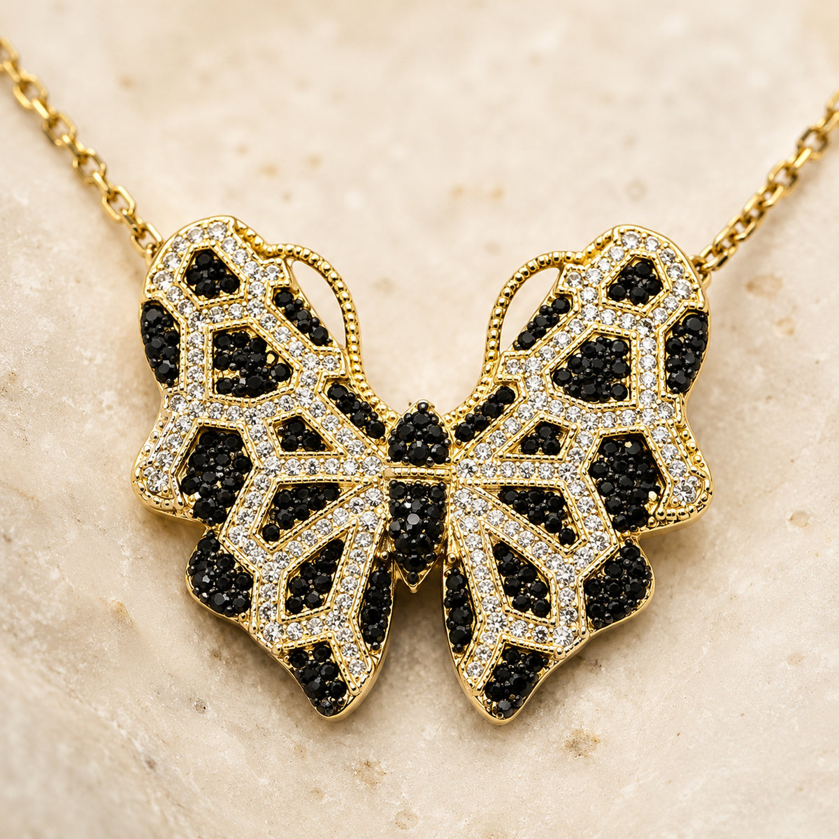 Close view of the butterfly pendant with black CZ accents.