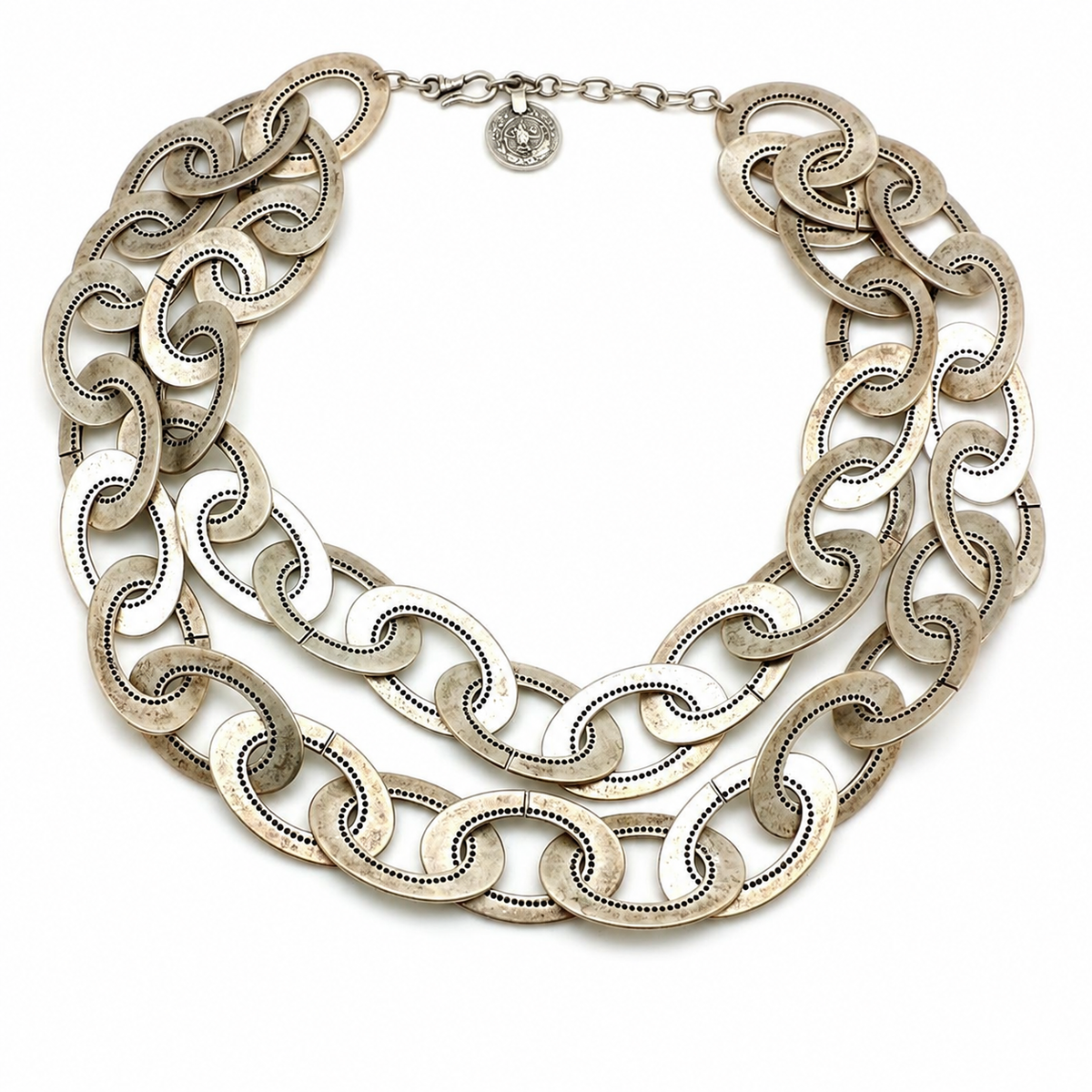 Oversized silver-tone chain link necklace with a bold layered silhouette.