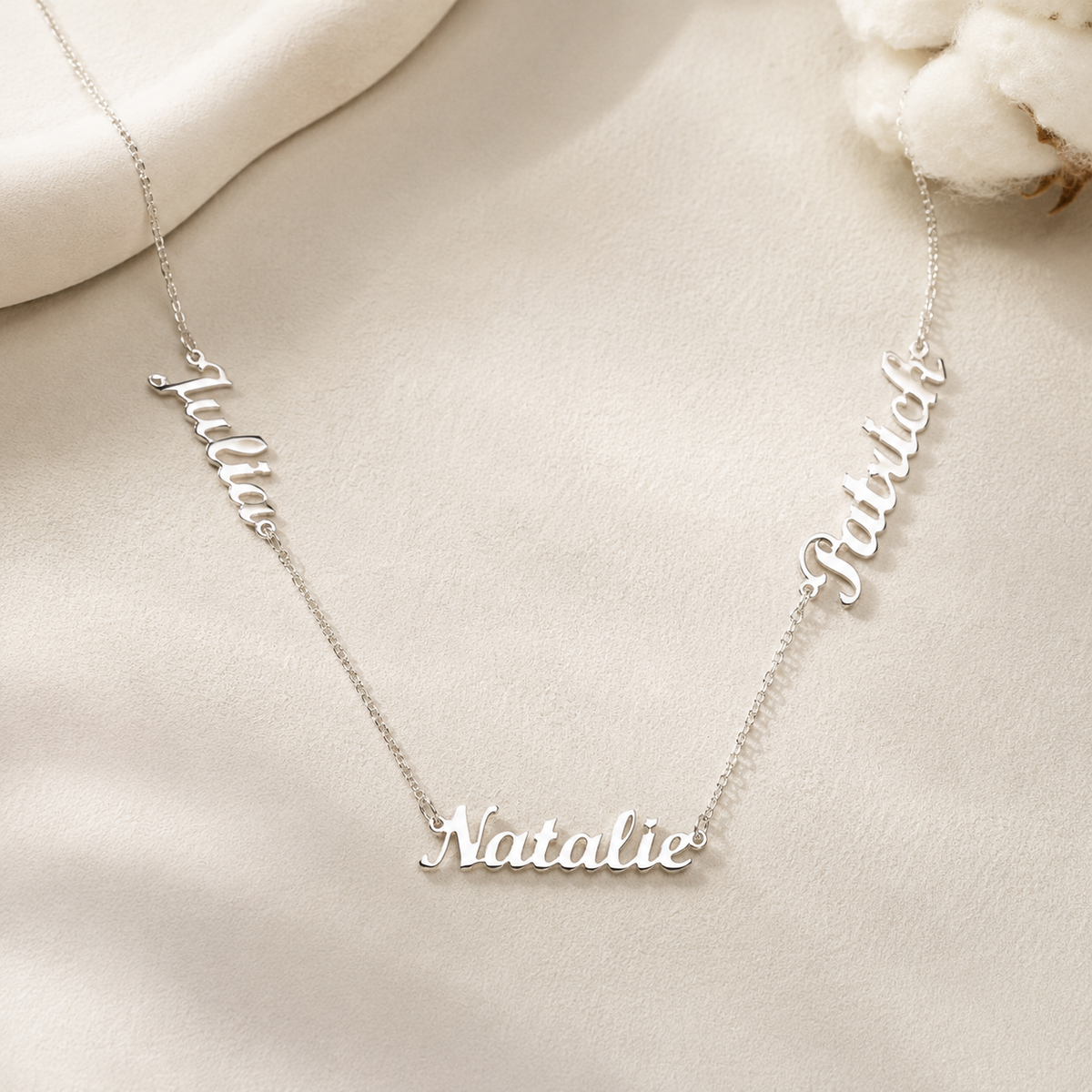 Personalized three name necklace with a delicate silver-tone chain.