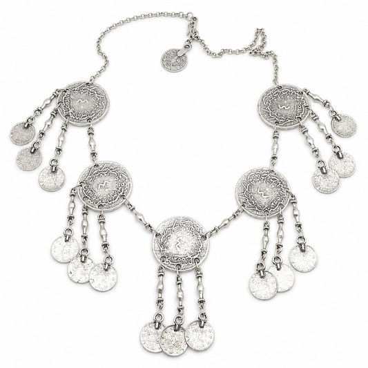 Silver-tone necklace with round coin pendants and fringe details on a white background.