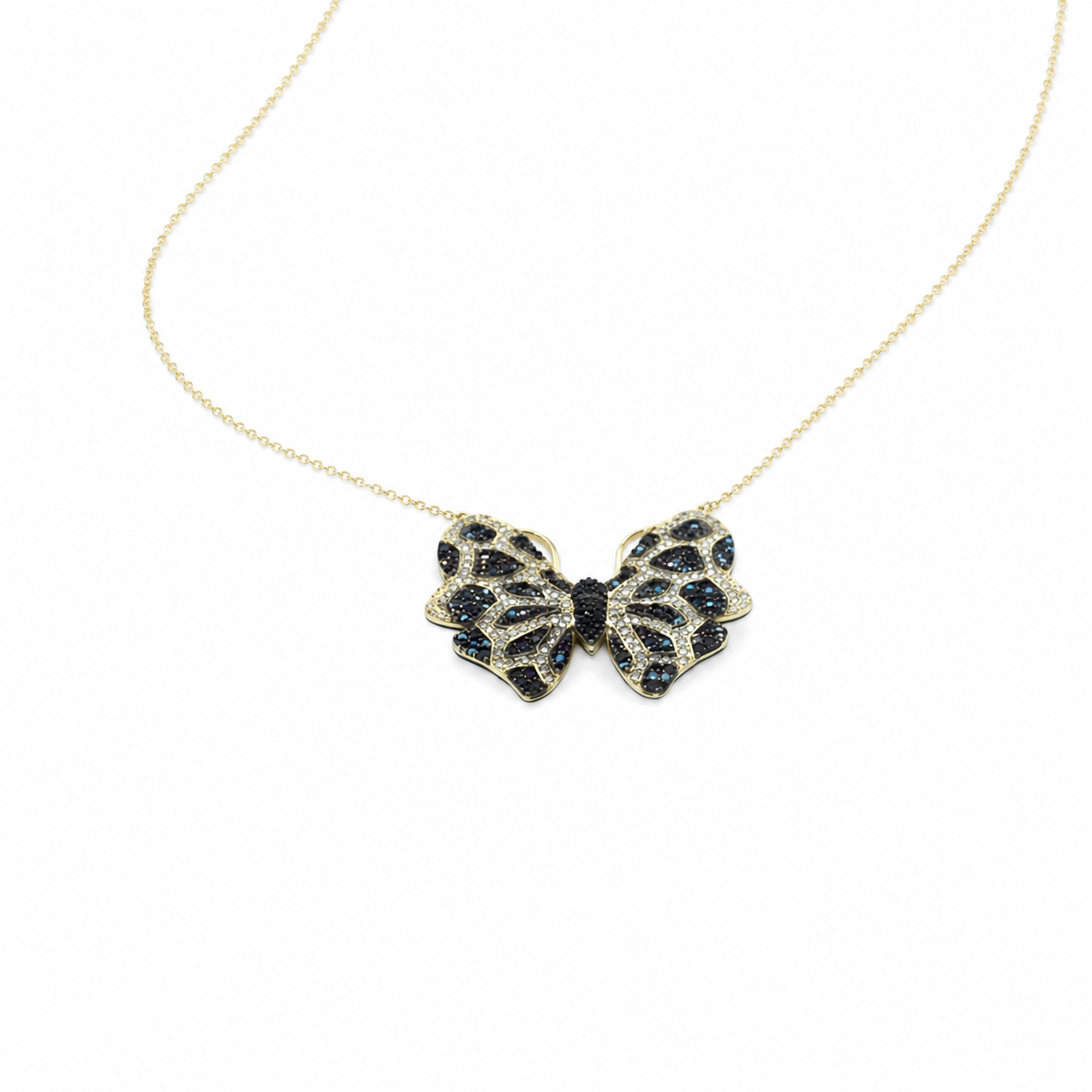 Angled view of a butterfly pendant necklace on a fine gold-tone chain.