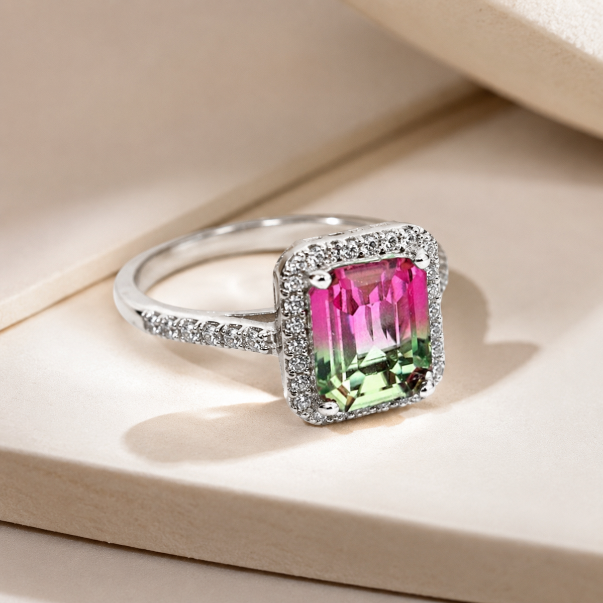 Angled view of a silver-tone ring with a purple stone halo.