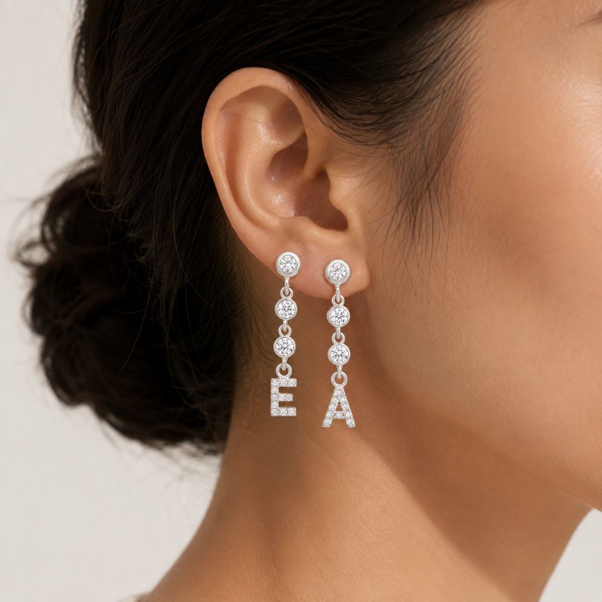 Personalized initial dangle earrings with a slim gold-tone chain and CZ accents.
