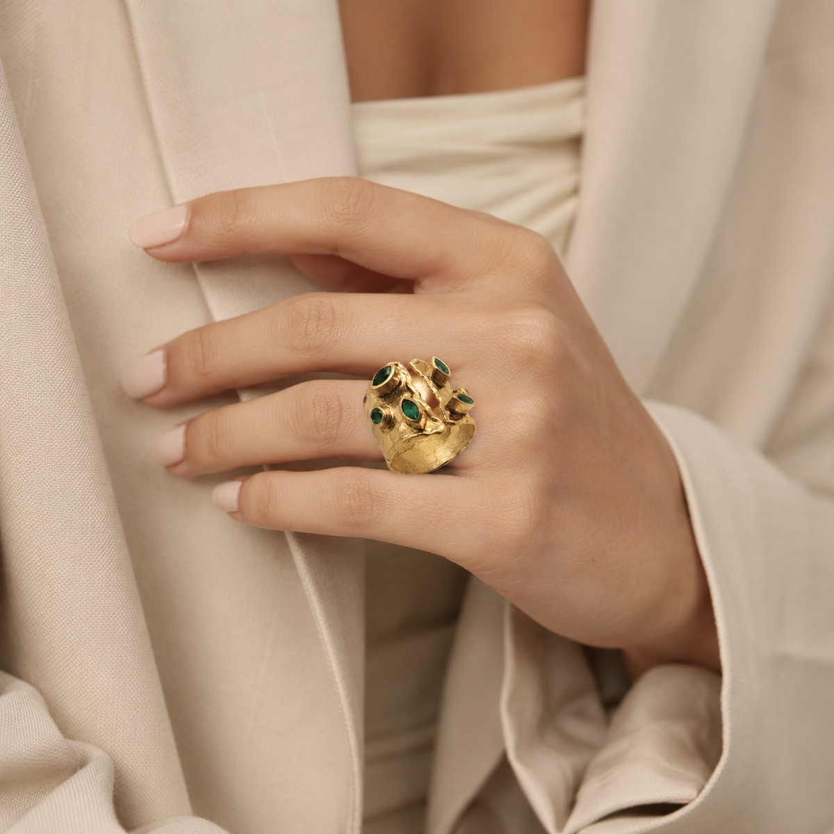 Gold-plated ring with multiple emerald green stone accents