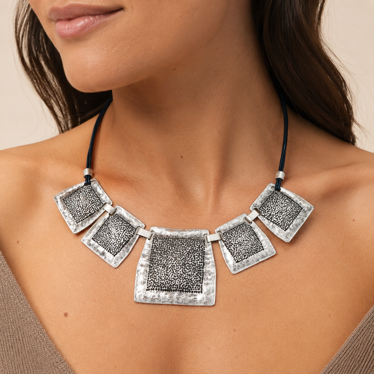 Textured square plate necklace shown from the front on a white background.