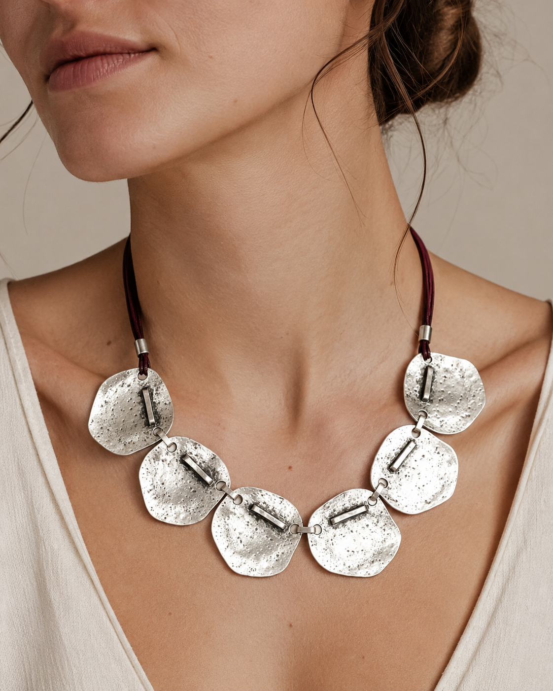 Hammered silver plate necklace shown front view on a white background.