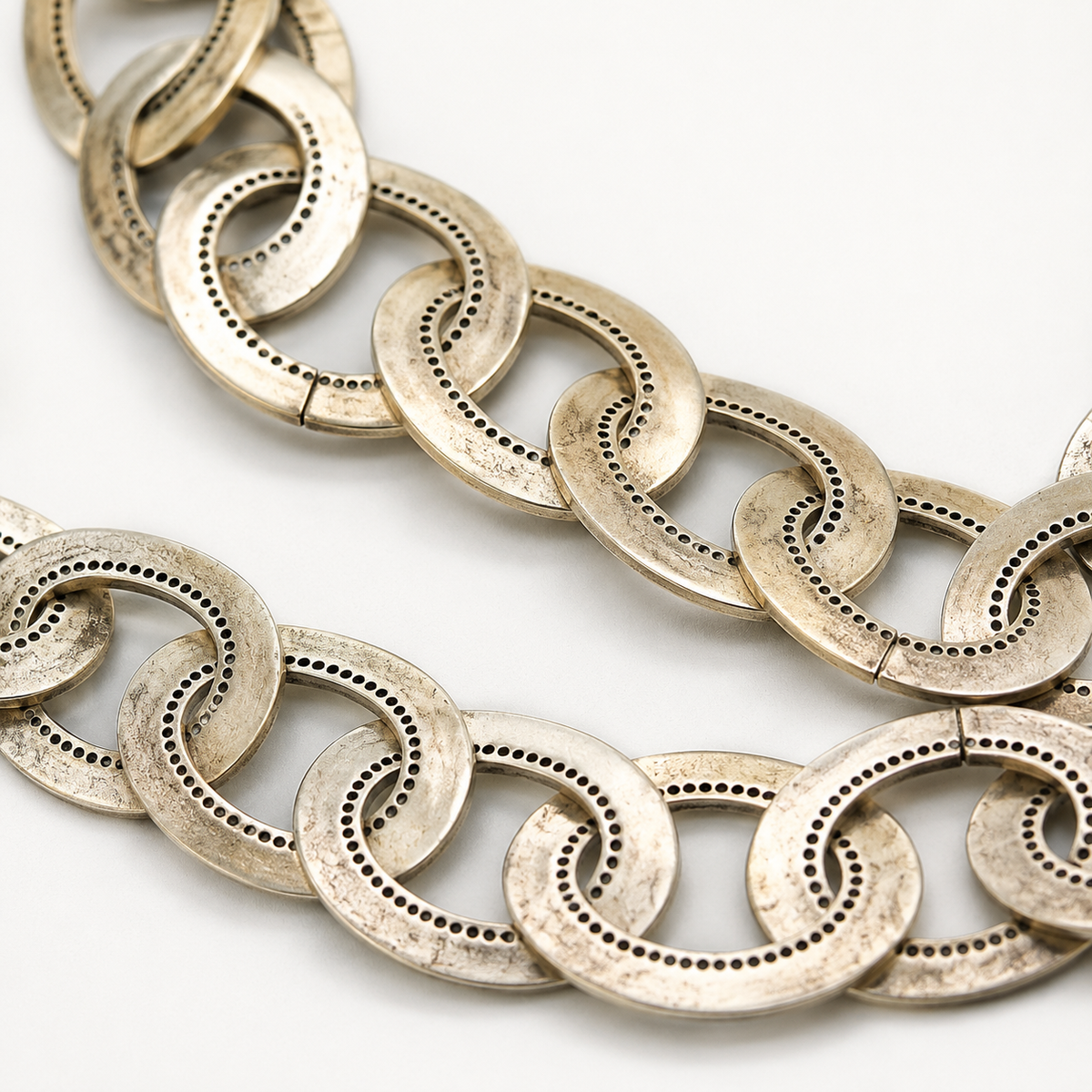 Close view of the oversized chain links and textured silver-tone finish.