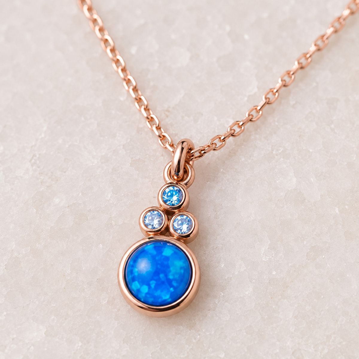 Close view of the blue opal pendant and small accent stones.