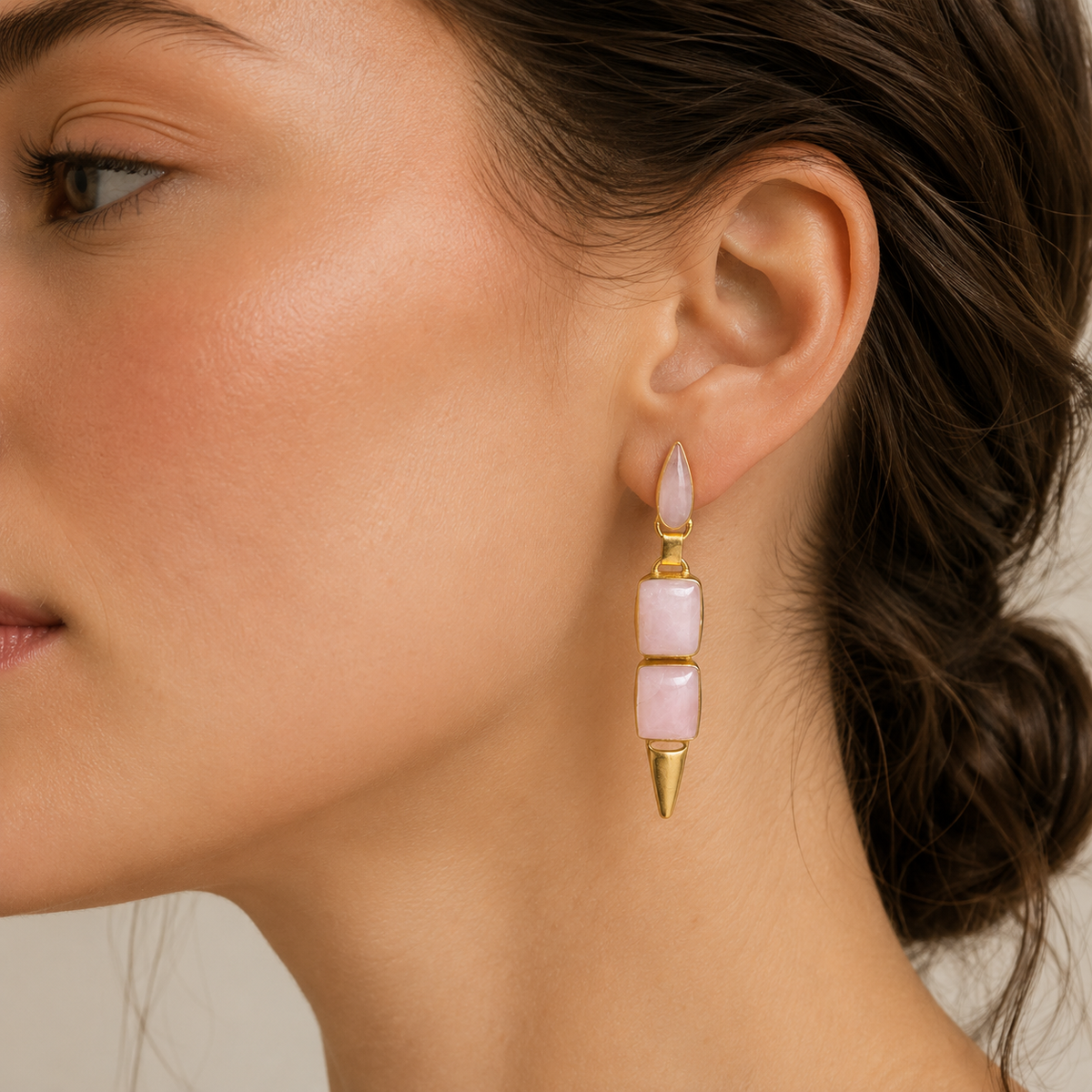 Geometric pink drop earrings with a gold-plated finish on a white background.