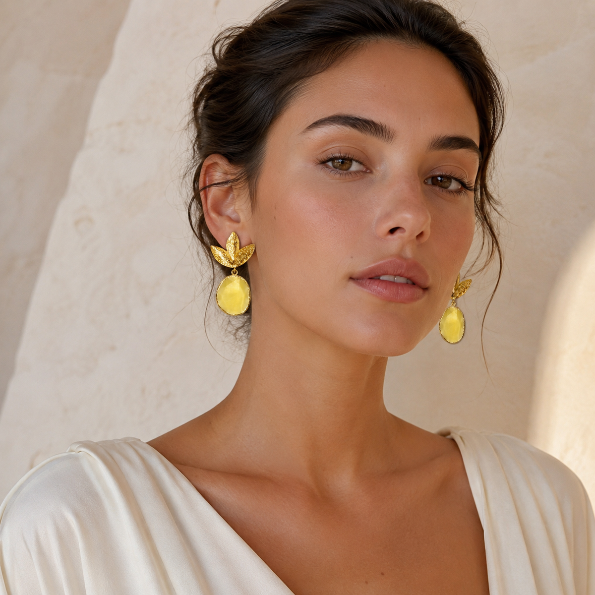 Gold plated earrings with layered leaf shapes and a mustard yellow drop.