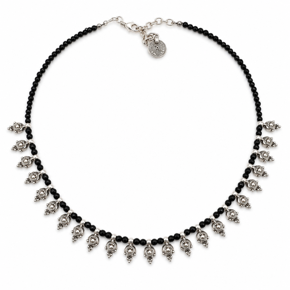 Black bead necklace with silver-tone dangle accents on a white background.