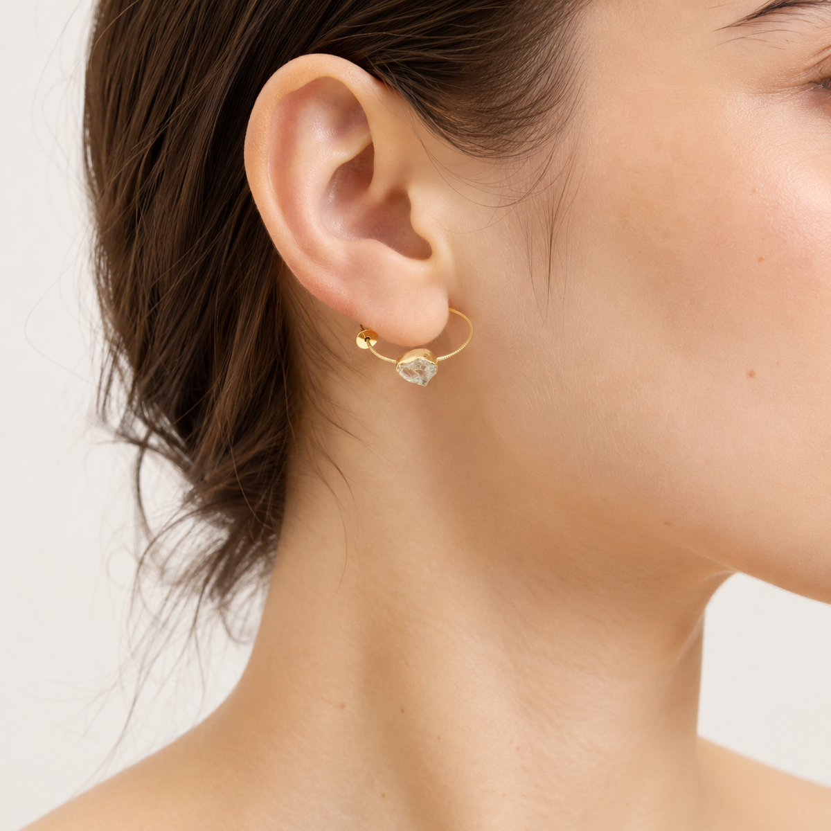 Yellow solar quartz hook earrings shown from the front on a white background.