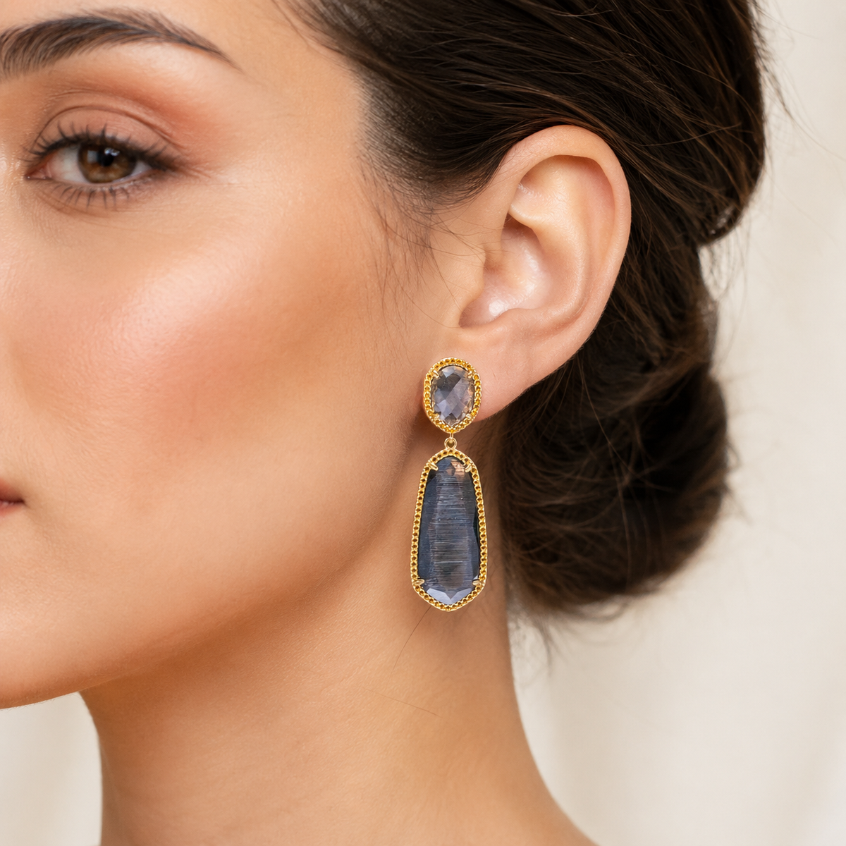Smoky gray cat eye drop earrings shown on a white background.