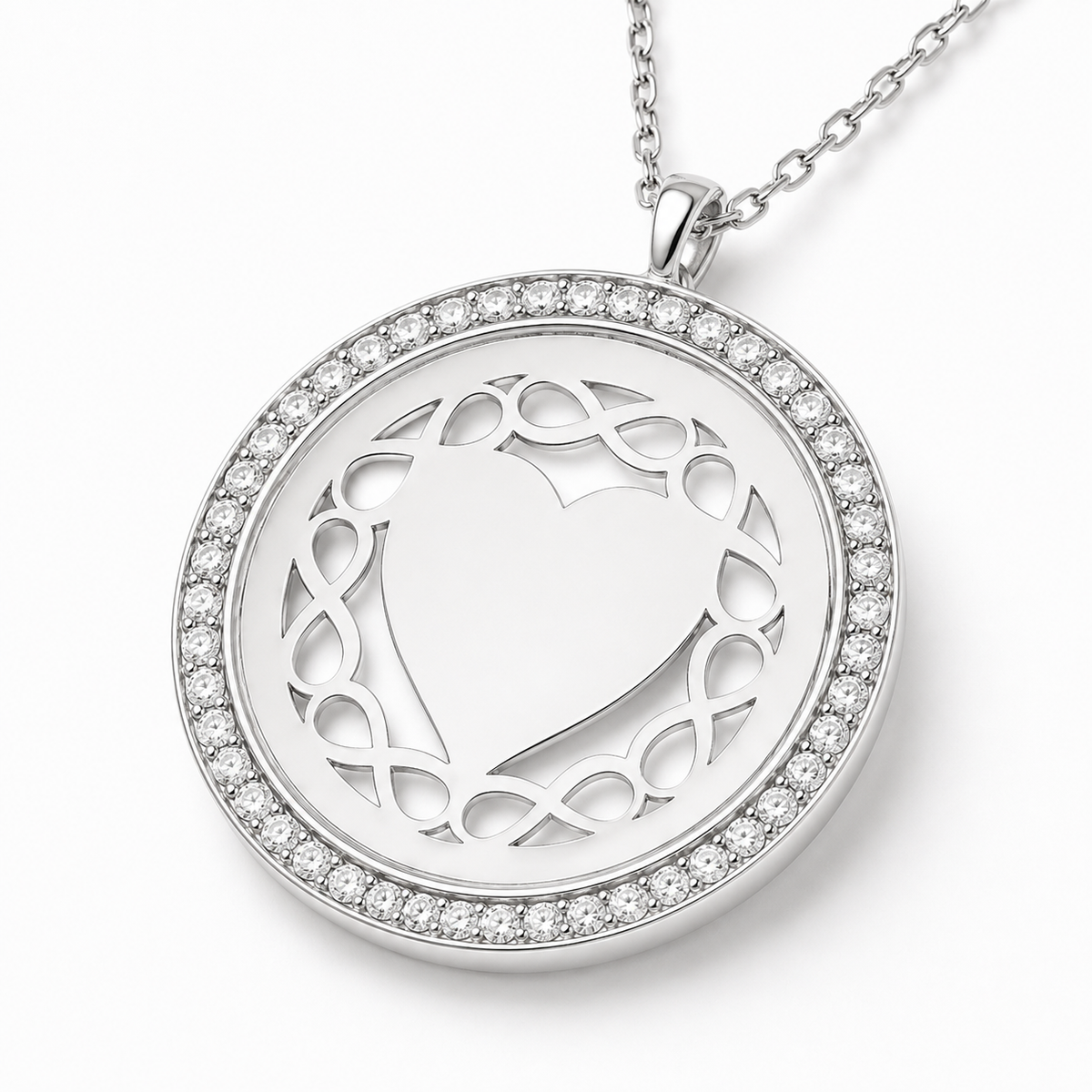 Close view of the round pendant showing the framed edge and heart detail.