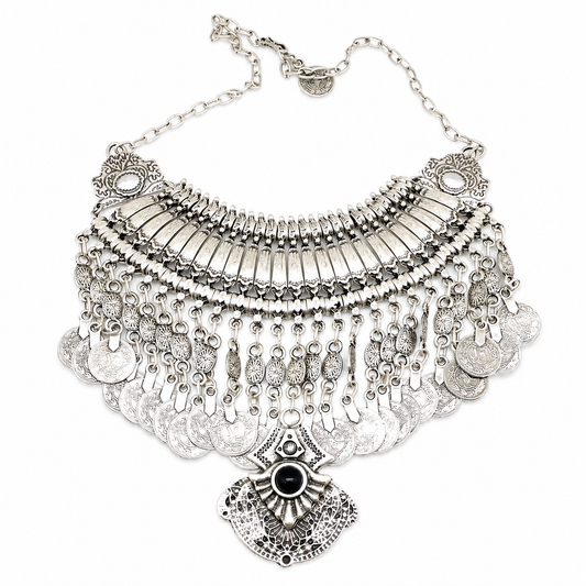 Silver-tone coin fringe necklace with a black stone pendant on a white background.