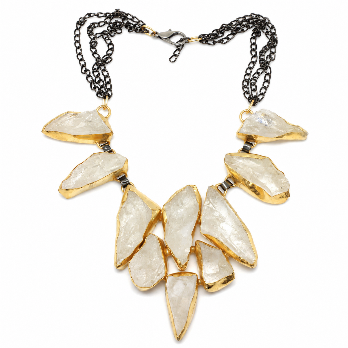 Rock crystal statement necklace with clear irregular stones and gold-tone settings.