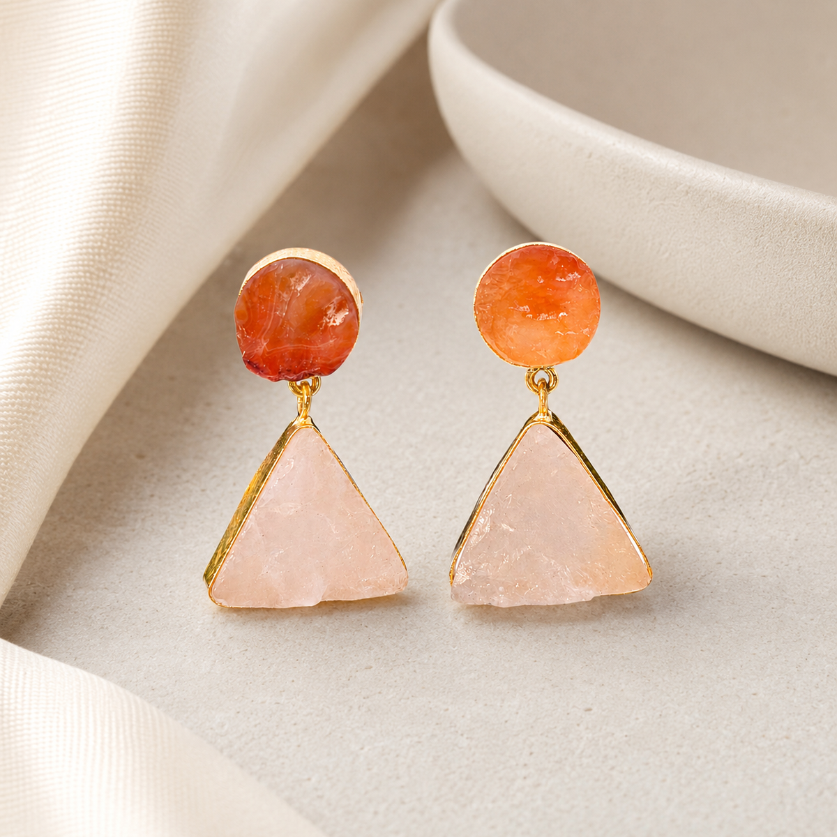 Gold-plated drop earrings with rose quartz and carnelian stones in a soft natural style.