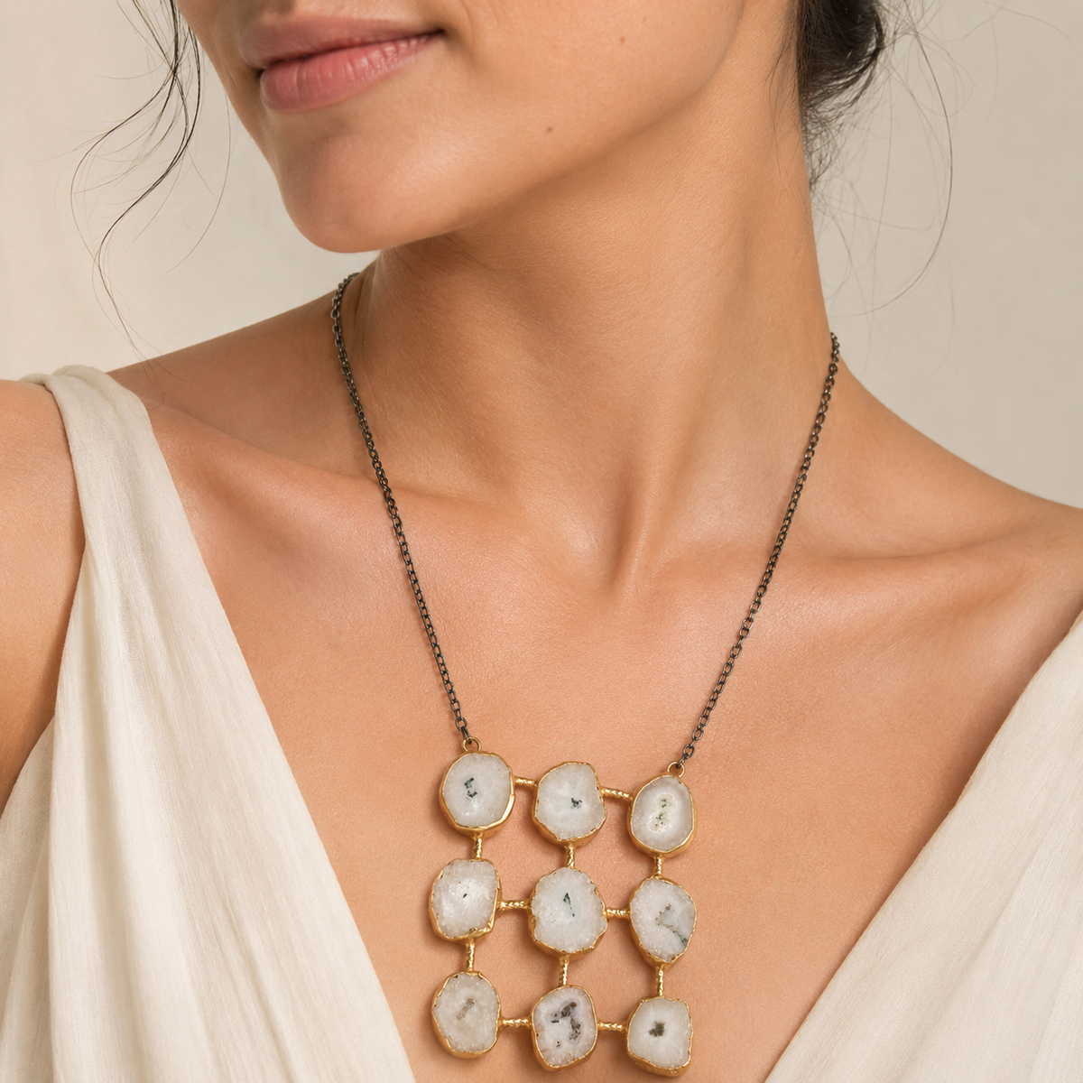Quartz-like stone grid pendant necklace shown on a white background.