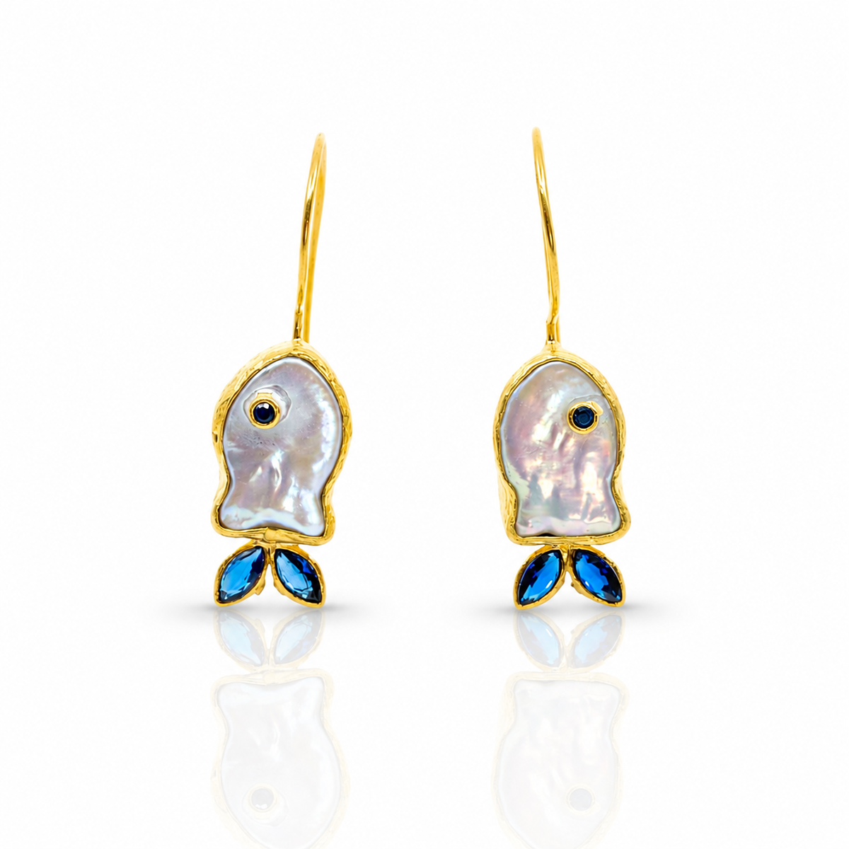 Gold-plated hook earrings with mother-of-pearl fish shapes and blue CZ accents.