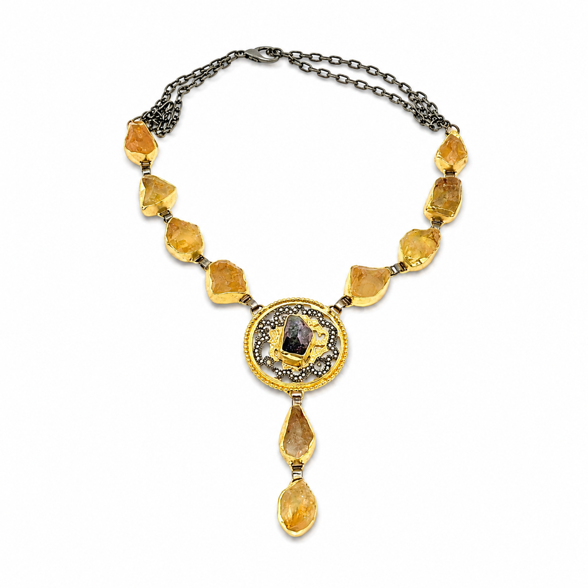 Citrine medallion drop necklace worn on the neck with golden stones and a detailed center pendant.