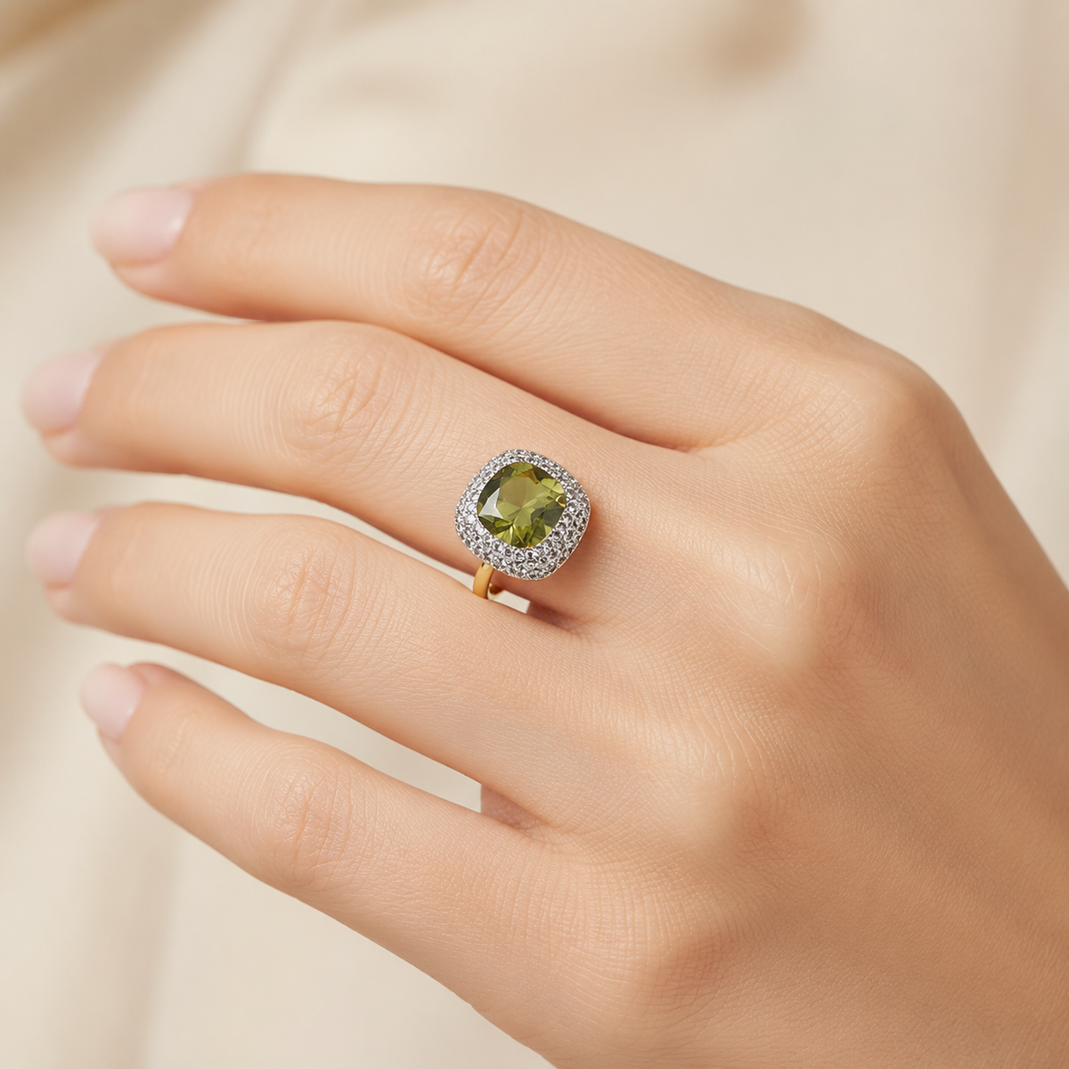Close view of a heart-shaped green ring with sparkling halo details.
