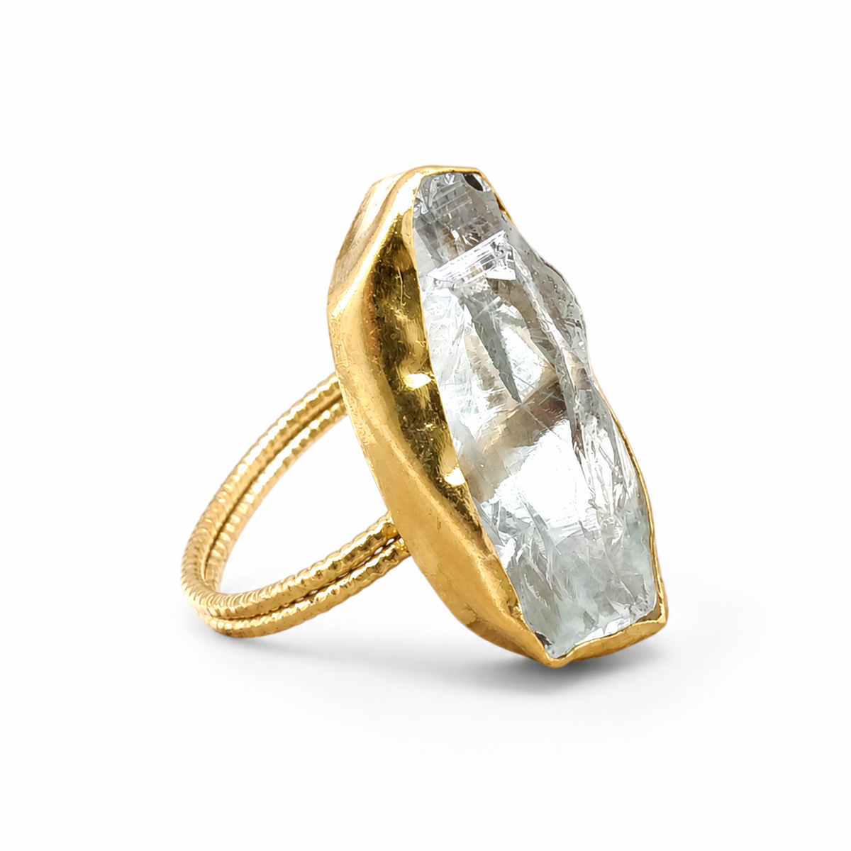 Raw crystal quartz statement ring with a gold-plated setting.