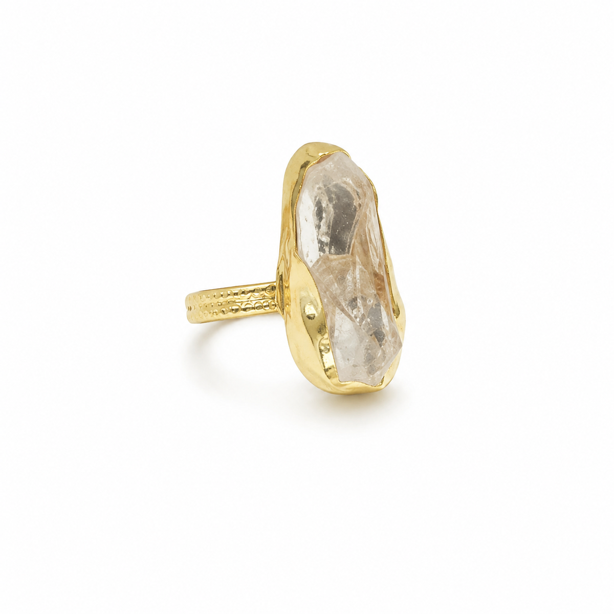 Raw clear quartz statement ring with a gold-plated setting.