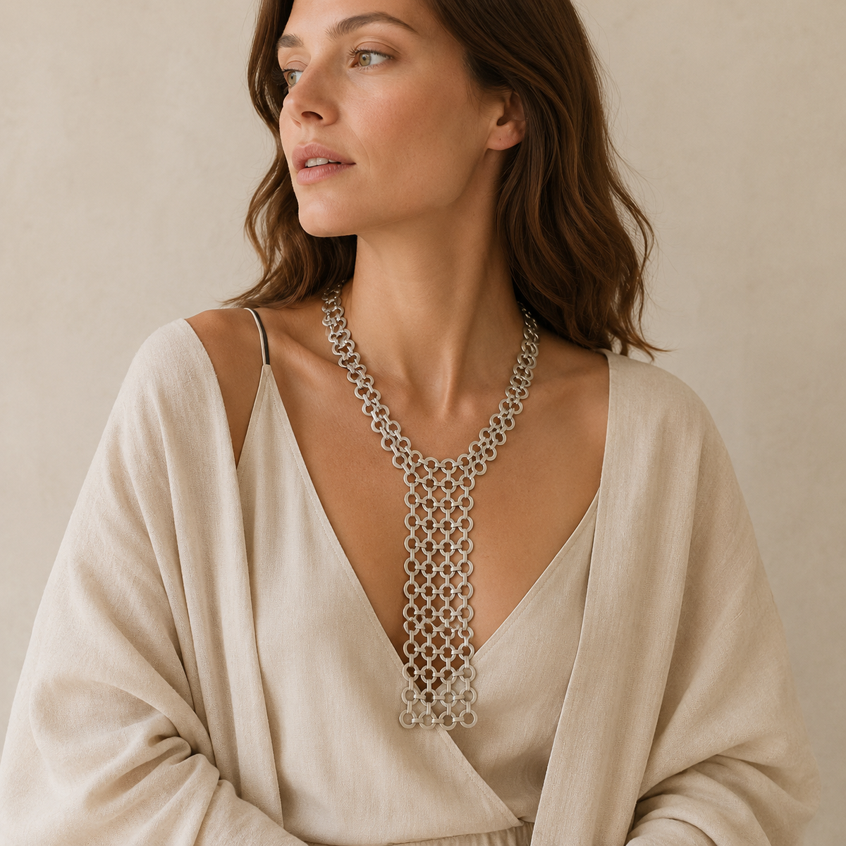 Silver link bib necklace with a polished metal finish.