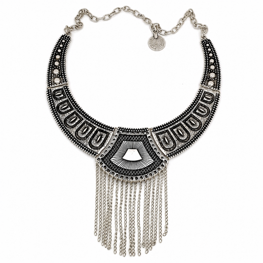 Black geometric statement necklace with a chain fringe and detailed panel design.