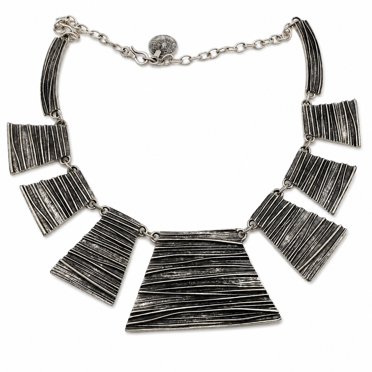 Silver-tone statement necklace with textured panel links.