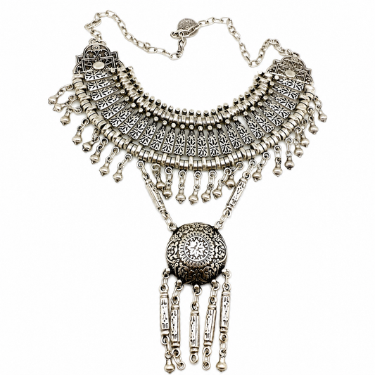 Silver-tone boho necklace with a fan-shaped upper section and round pendant.